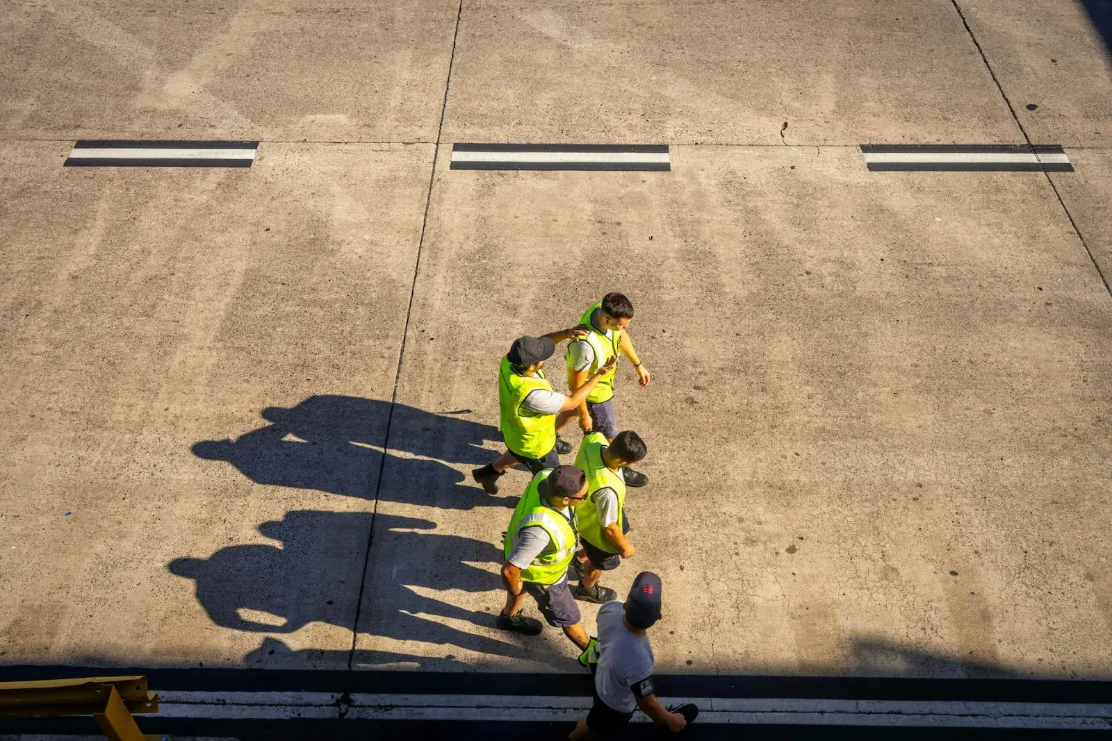 A team of workers in safety vests on a worksite